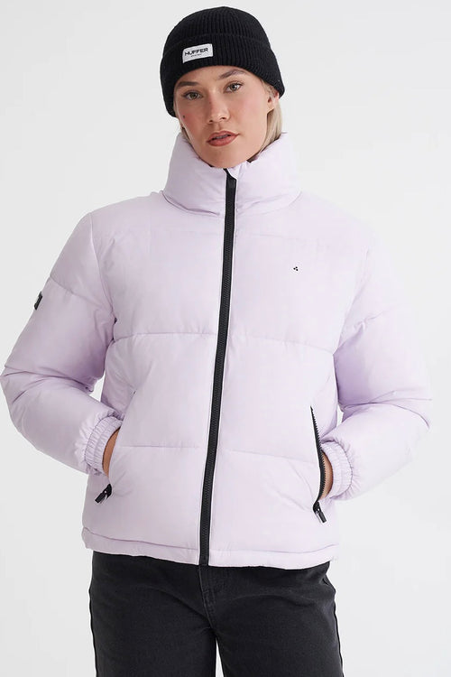 model wears a purple puffer jacket