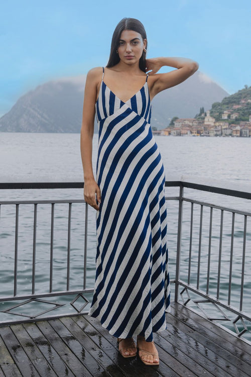 model wears navy and white stripe slip midi dress