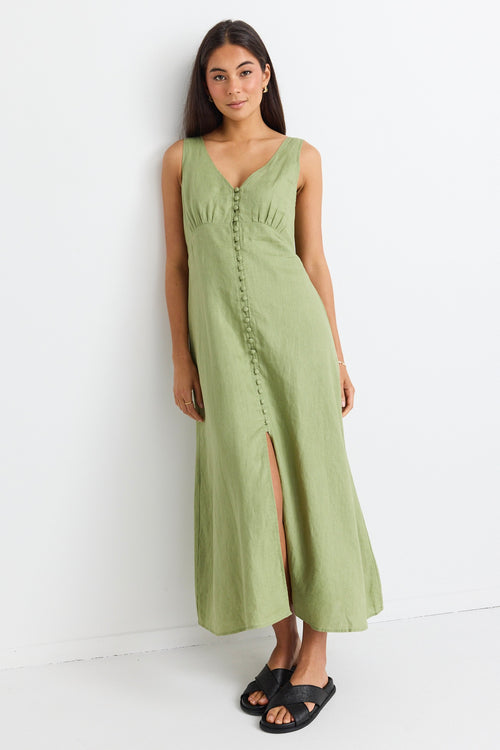 model wears a green linen midi dress