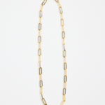 gold-plated brass paperclip chain necklace with elongated links, photographed flat on a white background.