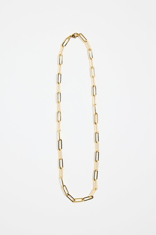 gold-plated brass paperclip chain necklace with elongated links, photographed flat on a white background.