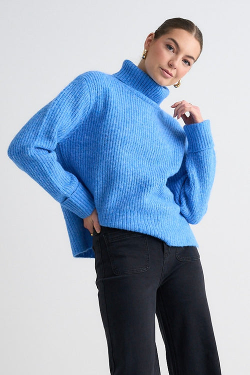 model wears a Blue Knit Jumper