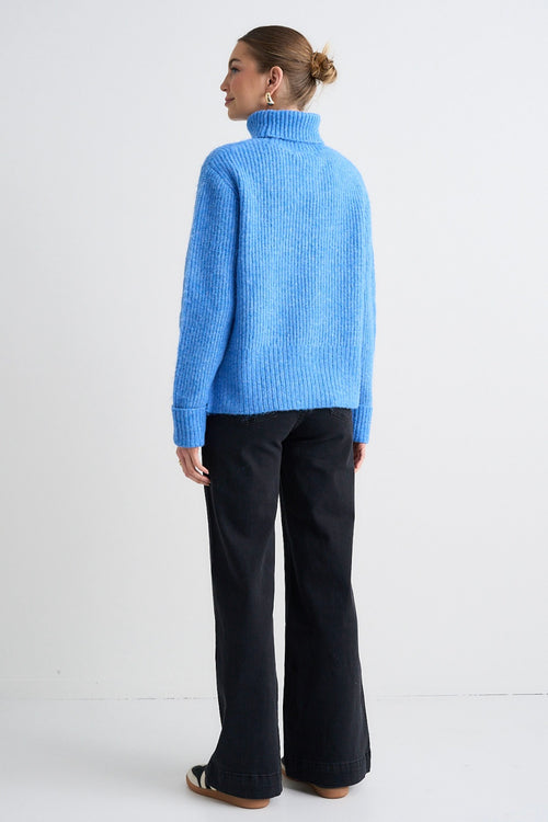 model wears a Blue Knit Jumper