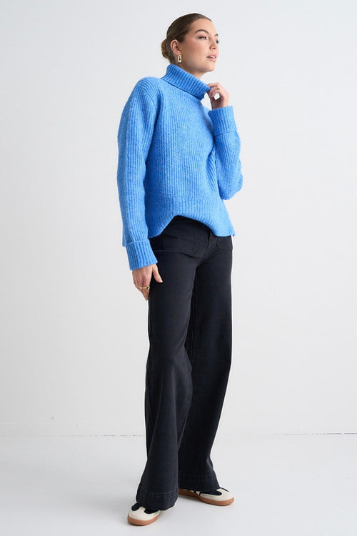 model wears a Blue Knit Jumper