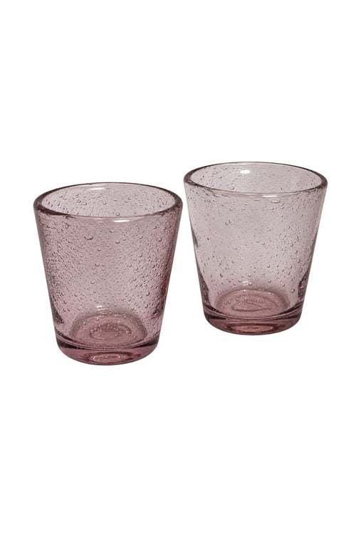 Pink handmade bubble glass tumbler with textured air bubble finish on a white background.