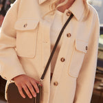 model wears a beige shacket