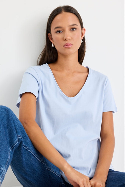 Woman wearing a blue cotton v neck top
