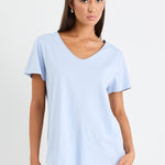 Woman wearing a blue cotton v neck top
