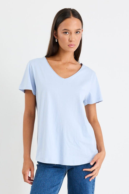 Woman wearing a blue cotton v neck top