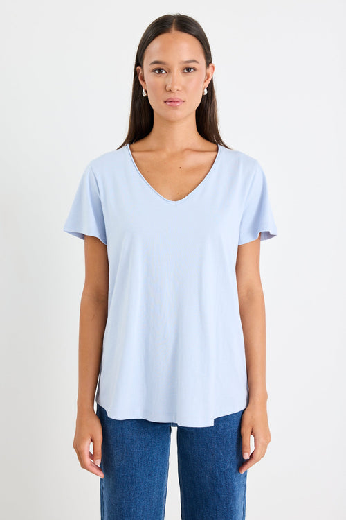 Woman wearing a blue cotton v neck top
