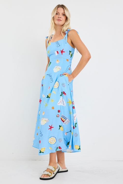 model wears a blue print midi dress