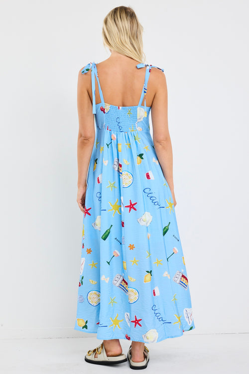 model wears a blue print midi dress