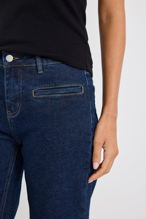 model wears dark blue wide leg jean