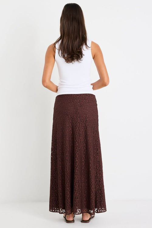 Woman wearing a chocolate lace maxi skirt
