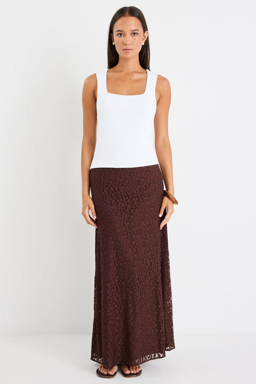 Woman wearing a chocolate lace maxi skirt