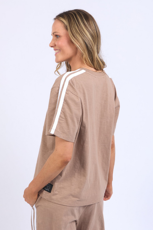 model wears brown tee shirt