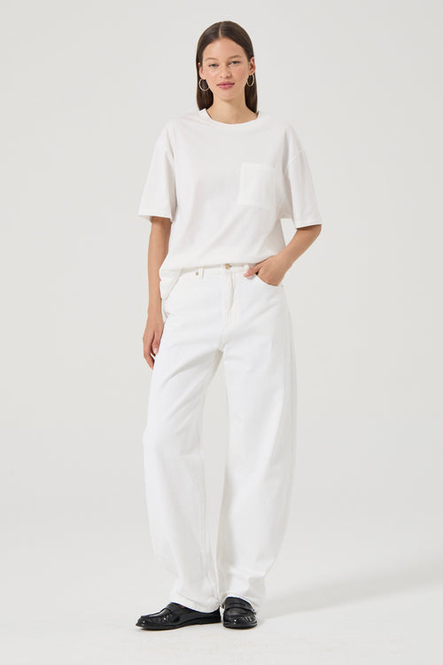 Woman wearing white wide leg jeans 