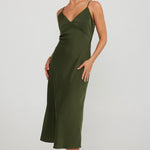 model wears a green slip midi dress