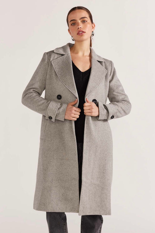 model wears a grey coat