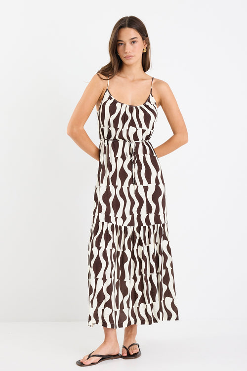 A strappy, tiered dress with a bold chocolate and cream geometric print. Made from 100% viscose for a light, breathable feel.