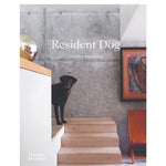 Book cover of 'Resident Dog' by Nicolle England with a dog on steps and a chair in the background.