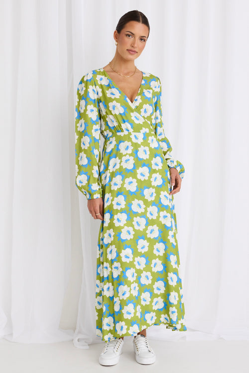 model wears a long sleeve green floral maxi dress