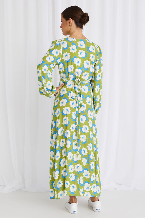 model wears a long sleeve green floral maxi dress