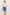 A woman modeling a white short-sleeve tie-front blouse and blue denim shorts against a plain off-white studio background.
