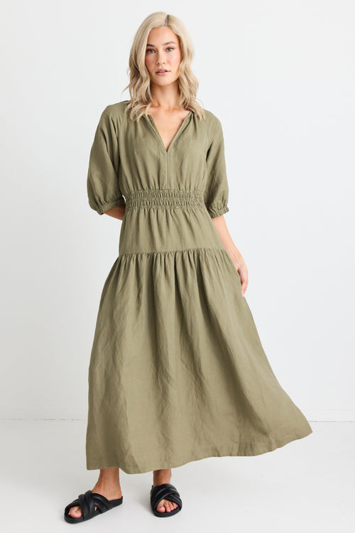 model wears light green maxi dress and black sandals