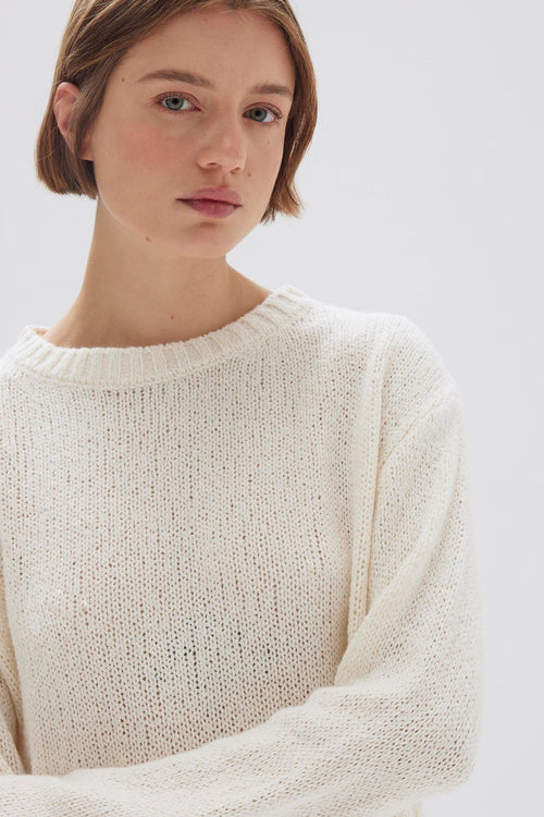 model wears a cream knit