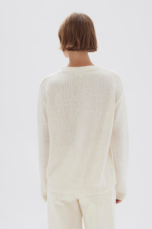 model wears a cream knit