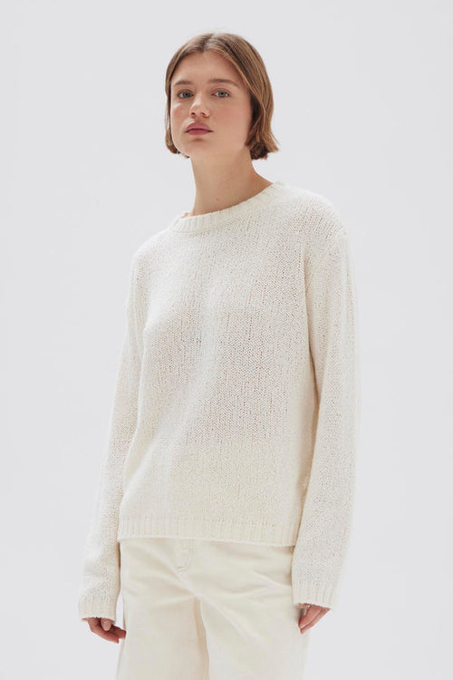 model wears a cream knit