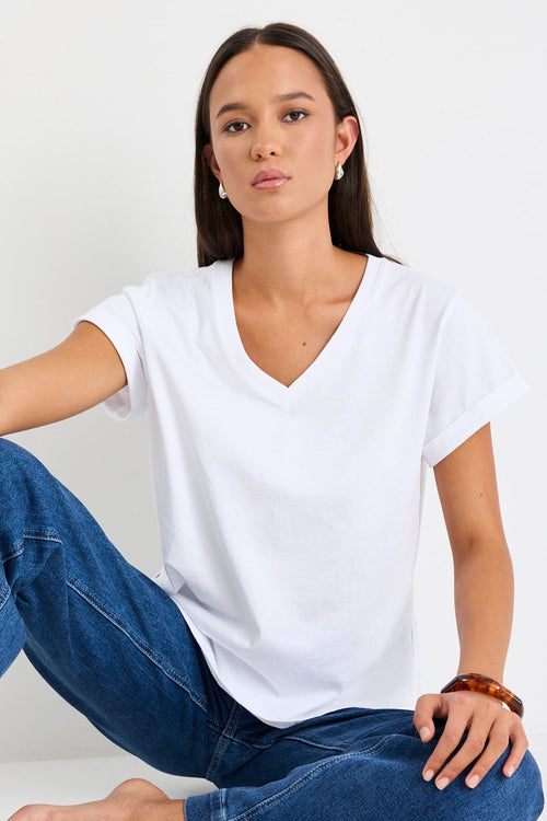 Women wearing a white shirt and blue jeans