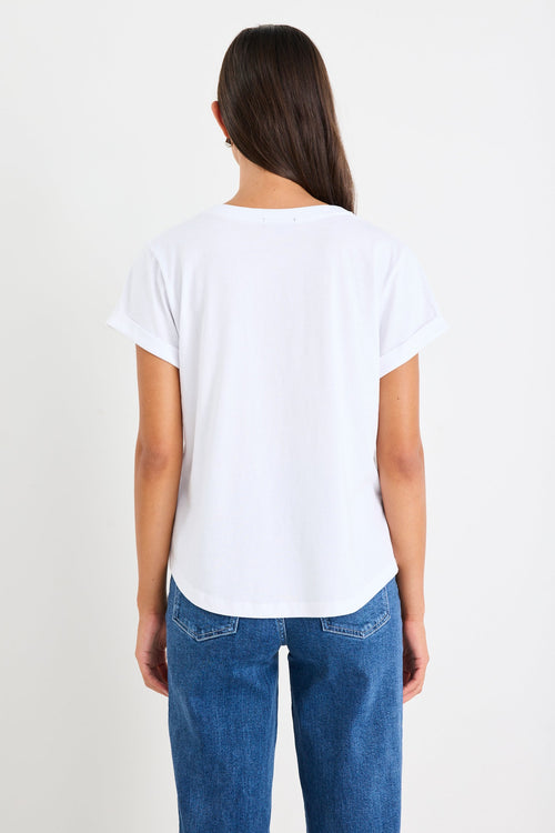 Women wearing a white shirt and blue jeans