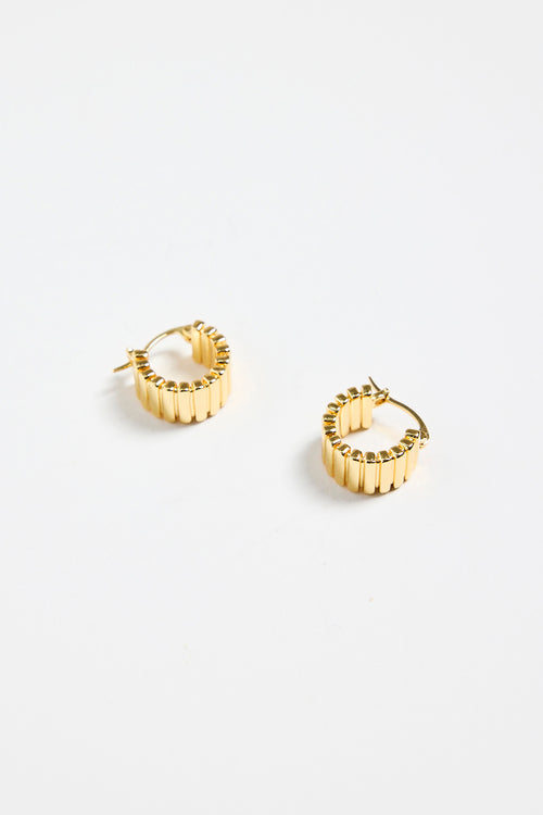gold-plated brass hoop earrings with a ridged texture, photographed flat against a white background.