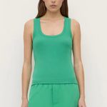 Woman wearing a Robyn Scoop Neck Rib Tank in green