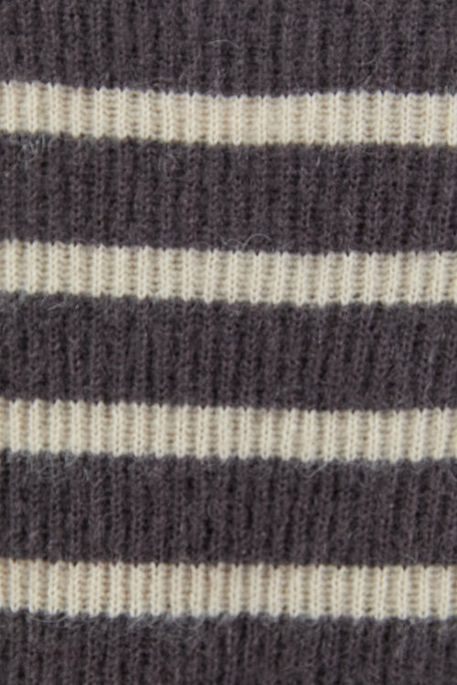Close-up of a striped fabric with dark and light horizontal bands.