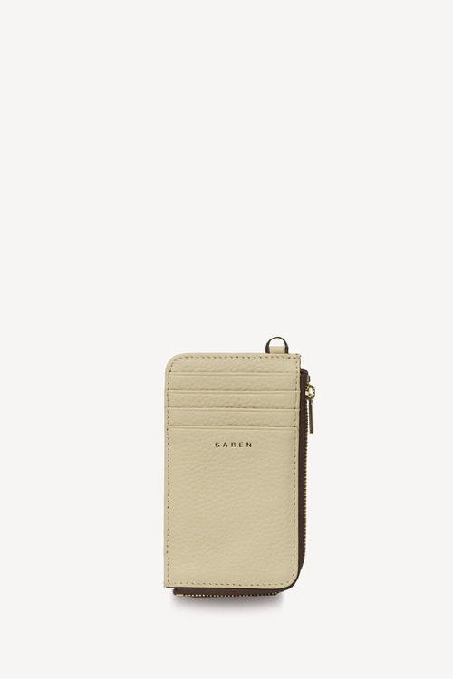 A slim beige leather card holder wallet with a top zipper and a small gold-tone ring detail, shown on a plain white background.