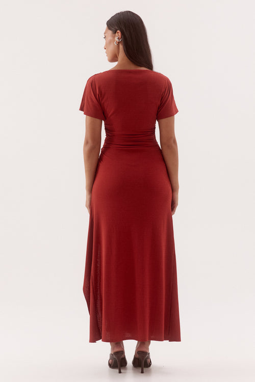 Woman wearing a red dress on a white background