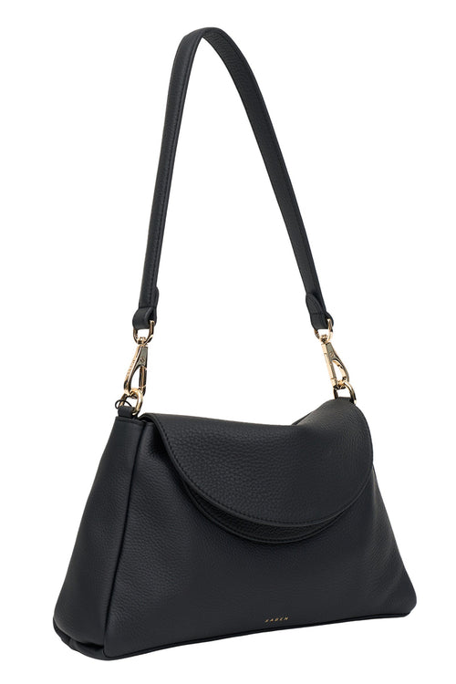 Black handbag with a gold clasp on a white background