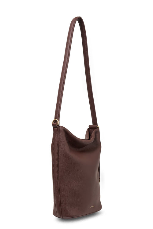 Brown leather shoulder bag on a white background