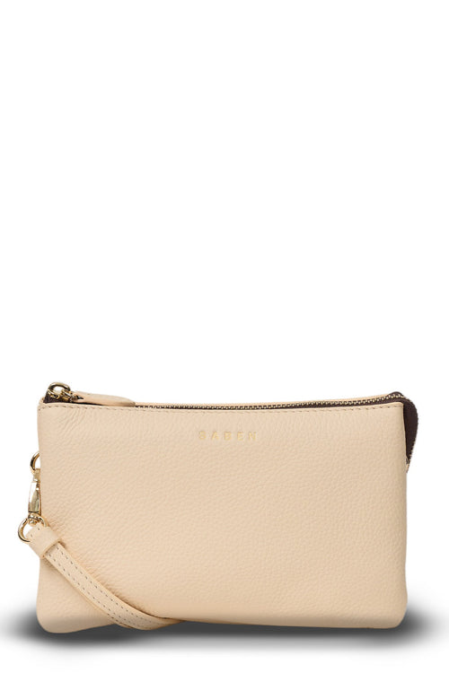 Beige handbag with a strap on a white background