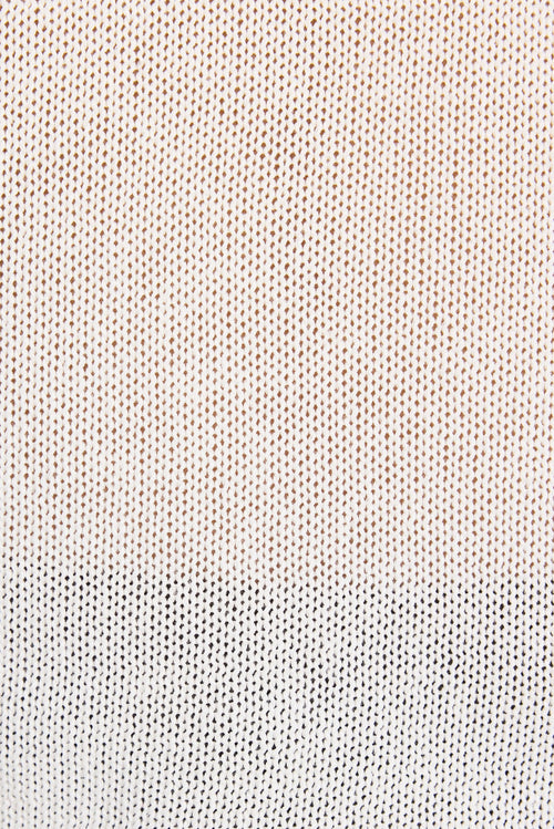 Close up of white knit top.