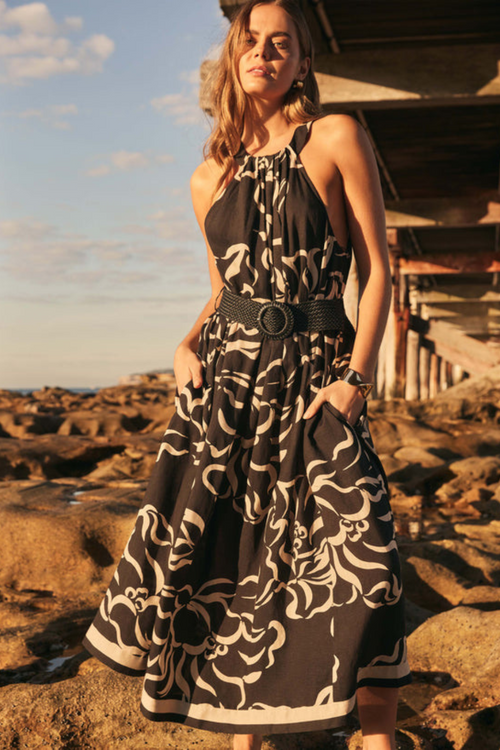 model wears black midi dress