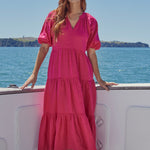 model wears a pink maxi dress