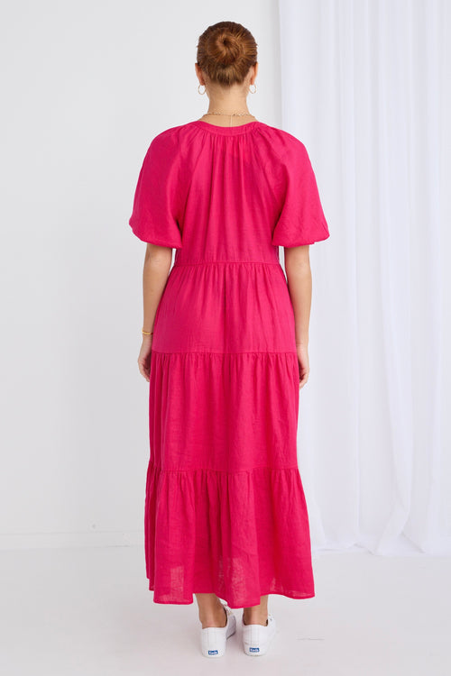 model wears a pink maxi dress