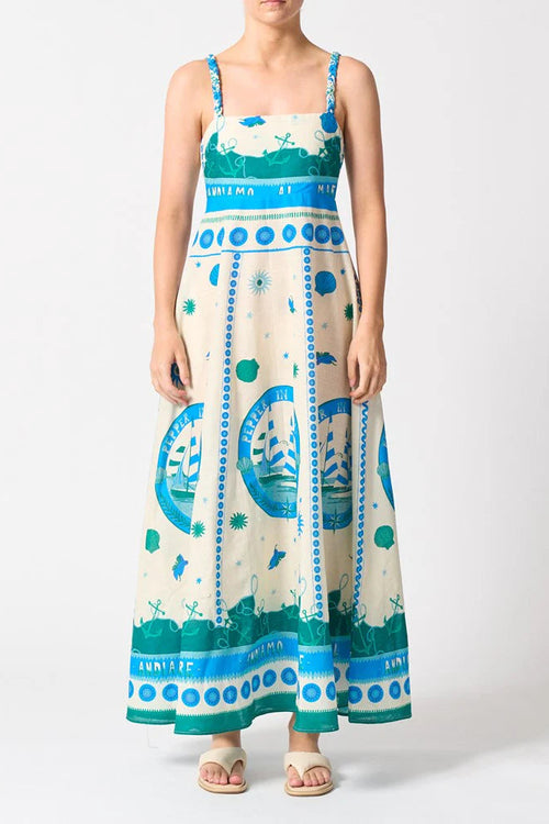 Woman wears a colourful blue strappy maxi dress