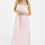 model wears a stripe pink and white dress 