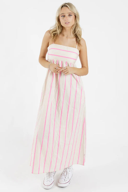 model wears a stripe pink and white dress 