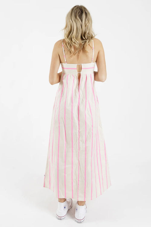 model wears a stripe pink and white dress 